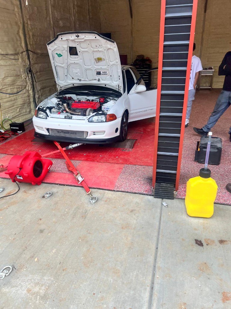 Honda Civic on the dyno with the hood open